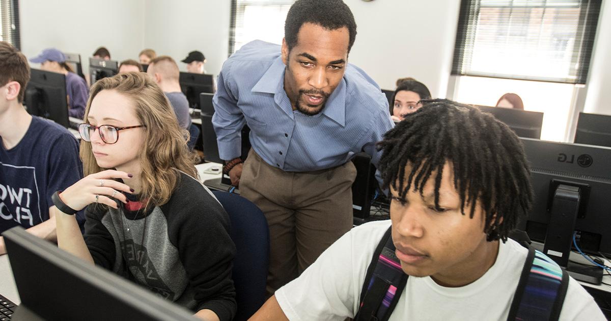 Dr. Mario Mighty guides students through their online classwork in his Geography class.